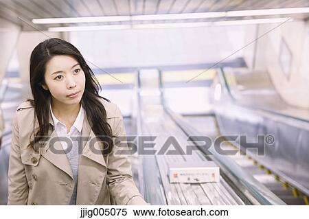 Young attractive Japanese woman at underground train station View Large Photo Image Stock Photography - Young attractive Japanese woman at underground train station. Fotosearch