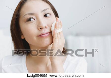 Young attractive Japanese woman doing her make-up at home View Large Photo Image Stock Photography - Young attractive Japanese woman doing her make-up at home. Fotosearch