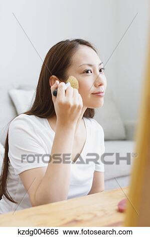 Young attractive Japanese woman doing her make-up at home View Large Photo Image Stock Photography - Young attractive Japanese woman doing her make-up at home. Fotosearch