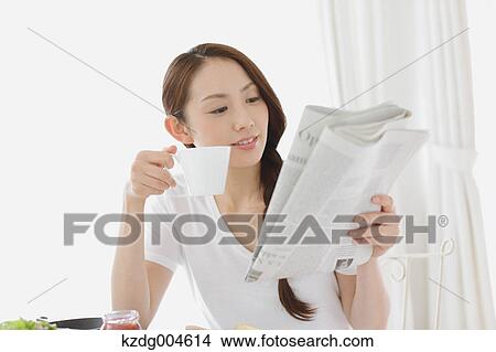 Young attractive Japanese woman having breakfast at home View Large Photo Image Picture - Young attractive Japanese woman having breakfast at home. Fotosearch