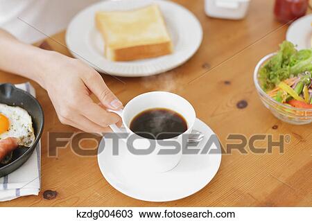 Young attractive Japanese woman having breakfast at home View Large Photo Image Stock Image - Young attractive Japanese woman having breakfast at home. Fotosearch
