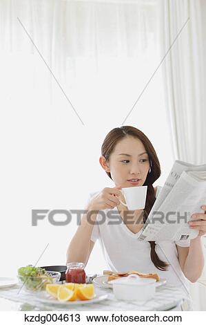 Young attractive Japanese woman having breakfast at home View Large Photo Image Stock Image - Young attractive Japanese woman having breakfast at home. Fotosearch