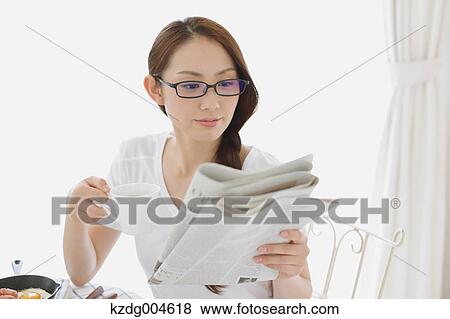 Young attractive Japanese woman having breakfast at home View Large Photo Image Stock Photo - Young attractive Japanese woman having breakfast at home. Fotosearch