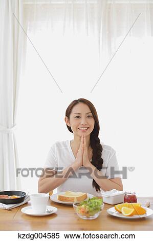 Young attractive Japanese woman having breakfast at home View Large Photo Image Stock Photography - Young attractive Japanese woman having breakfast at home. Fotosearch