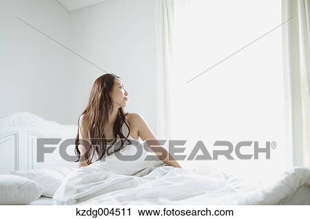 Young attractive Japanese woman in bed View Large Photo Image Stock Image - Young attractive Japanese woman in bed. Fotosearch