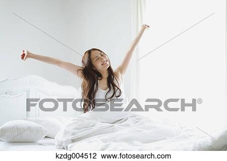 Young attractive Japanese woman in bed View Large Photo Image Stock Image - Young attractive Japanese woman in bed. Fotosearch