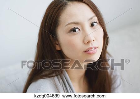 Stock Photo - Young attractive Japanese woman portrait. Fotosearch