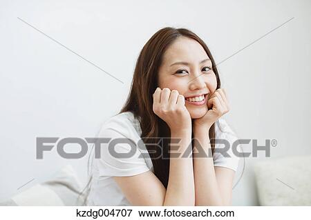 Stock Photo - Young attractive Japanese woman portrait. Fotosearch