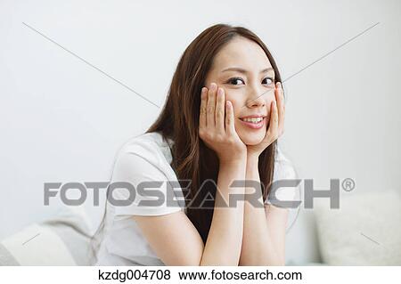 Stock Photo - Young attractive Japanese woman portrait. Fotosearch
