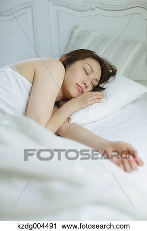 Young attractive Japanese woman sleeping in bed View Large Photo Image Stock Image - Young attractive Japanese woman sleeping in bed. Fotosearch