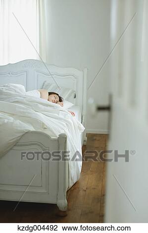 Young attractive Japanese woman sleeping in bed View Large Photo Image Stock Image - Young attractive Japanese woman sleeping in bed. Fotosearch