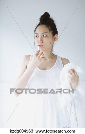 Young attractive Japanese woman brushing teeth in the bathroom View Large Photo Image Stock Image - Young attractive Japanese woman brushing teeth in the bathroom. Fotosearch