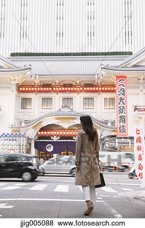 Young attractive Japanese woman downtown Tokyo View Large Photo Image Stock Photo - Young attractive Japanese woman downtown Tokyo. Fotosearch
