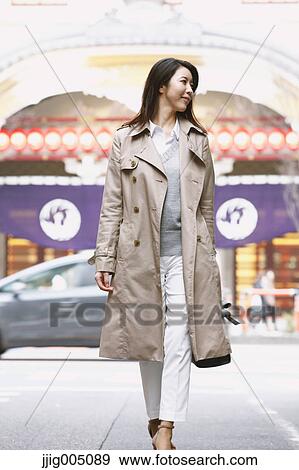 Young attractive Japanese woman downtown Tokyo View Large Photo Image Stock Photo - Young attractive Japanese woman downtown Tokyo. Fotosearch