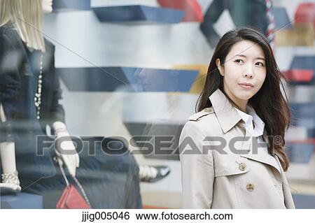 Stock Photograph - Young attractive Japanese woman downtown Tokyo. Fotosearch