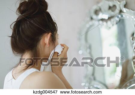Young attractive Japanese woman wiping face with towel in the bathroom View Large Photo Image Stock Photo - Young attractive Japanese woman wiping face with towel in the bathroom. Fotosearch