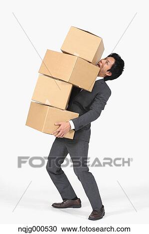 Young Japanese businessman carrying boxes View Large Photo Image Stock Image - Young Japanese businessman carrying boxes. Fotosearch
