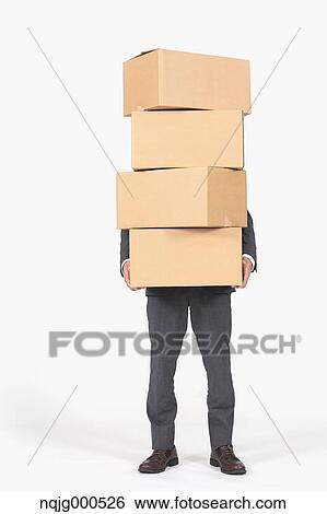 Young Japanese businessman carrying boxes View Large Photo Image Stock Photograph - Young Japanese businessman carrying boxes. Fotosearch