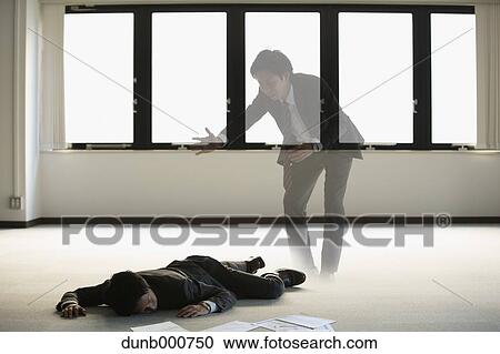 Young Japanese businessman dead on the floor of an empty office View Large Photo Image Stock Image - Young Japanese businessman dead on the floor of an empty office. Fotosearch