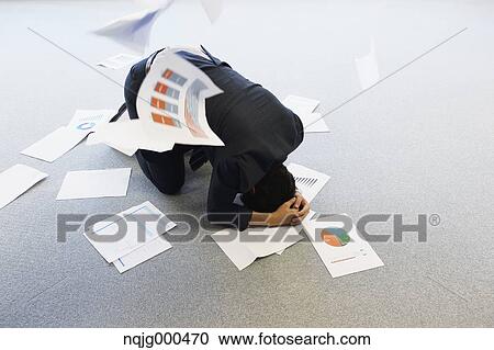 Young Japanese businessman with lots of scattered documents View Large Photo Image Stock Image - Young Japanese businessman with lots of scattered documents. Fotosearch