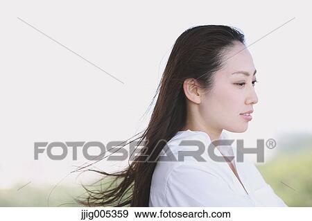 Young Japanese woman at observation deck in a city park View Large Photo Image Stock Photo - Young Japanese woman at observation deck in a city park. Fotosearch