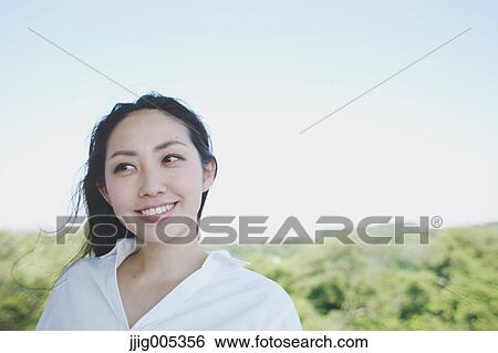 Young Japanese woman at observation deck in a city park View Large Photo Image Stock Photograph - Young Japanese woman at observation deck in a city park. Fotosearch