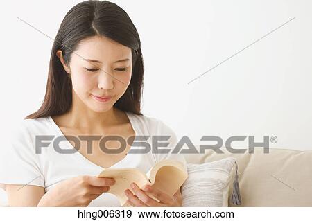 Young Japanese woman on the sofa in a white room View Large Photo Image Stock Photo - Young Japanese woman on the sofa in a white room. Fotosearch