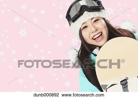 Young Japanese woman snowboarding View Large Photo Image Stock Image - Young Japanese woman snowboarding. Fotosearch