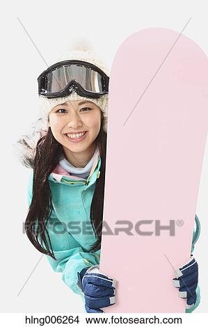 Young Japanese woman wearing snowboard wear on white background View Large Photo Image Picture - Young Japanese woman wearing snowboard wear on white background. Fotosearch