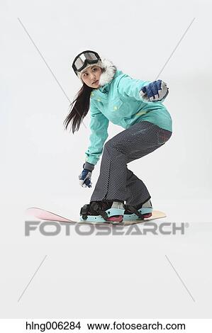Young Japanese woman wearing snowboard wear on white background View Large Photo Image Picture - Young Japanese woman wearing snowboard wear on white background. Fotosearch
