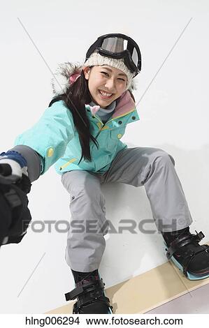 Young Japanese woman wearing snowboard wear on white background View Large Photo Image Picture - Young Japanese woman wearing snowboard wear on white background. Fotosearch