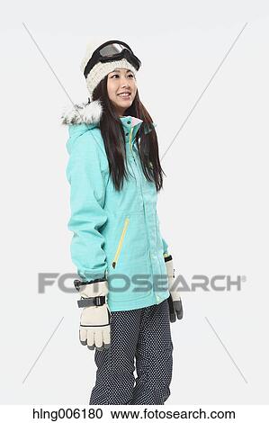 Young Japanese woman wearing snowboard wear on white background View Large Photo Image Stock Image - Young Japanese woman wearing snowboard wear on white background. Fotosearch