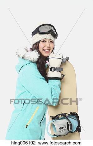 Young Japanese woman wearing snowboard wear on white background View Large Photo Image Stock Image - Young Japanese woman wearing snowboard wear on white background. Fotosearch
