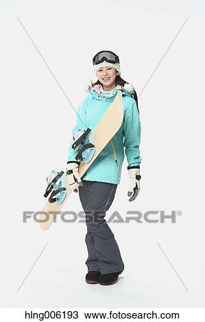 Young Japanese woman wearing snowboard wear on white background View Large Photo Image Stock Image - Young Japanese woman wearing snowboard wear on white background. Fotosearch