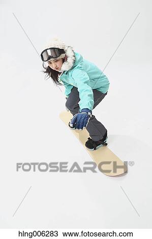 Young Japanese woman wearing snowboard wear on white background View Large Photo Image Stock Image - Young Japanese woman wearing snowboard wear on white background. Fotosearch