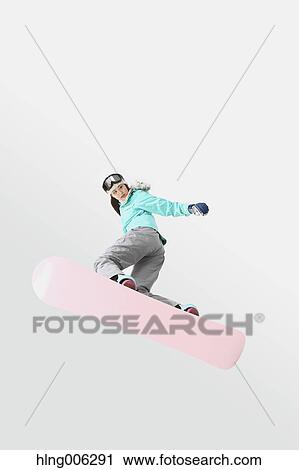 Young Japanese woman wearing snowboard wear on white background View Large Photo Image Stock Image - Young Japanese woman wearing snowboard wear on white background. Fotosearch