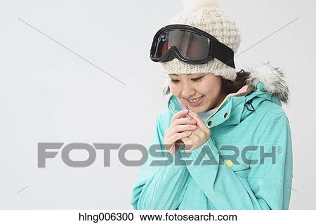 Young Japanese woman wearing snowboard wear on white background View Large Photo Image Stock Image - Young Japanese woman wearing snowboard wear on white background. Fotosearch
