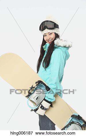 Young Japanese woman wearing snowboard wear on white background View Large Photo Image Stock Photo - Young Japanese woman wearing snowboard wear on white background. Fotosearch