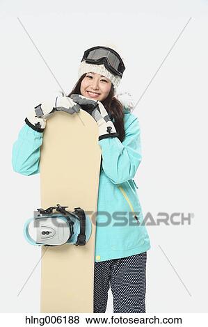Young Japanese woman wearing snowboard wear on white background View Large Photo Image Stock Photo - Young Japanese woman wearing snowboard wear on white background. Fotosearch