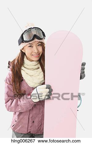 Young Japanese woman wearing snowboard wear on white background View Large Photo Image Stock Photo - Young Japanese woman wearing snowboard wear on white background. Fotosearch