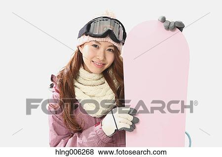Young Japanese woman wearing snowboard wear on white background View Large Photo Image Stock Photo - Young Japanese woman wearing snowboard wear on white background. Fotosearch