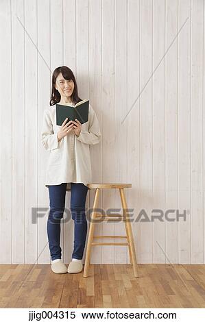 Young Japanese woman with book View Large Photo Image Stock Photography - Young Japanese woman with book. Fotosearch