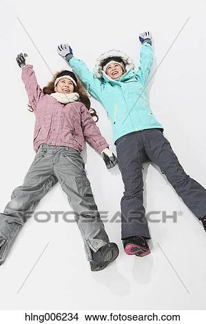 Young Japanese women wearing snowboard wear on white background View Large Photo Image Picture - Young Japanese women wearing snowboard wear on white background. Fotosearch