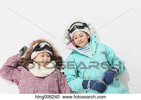 Young Japanese women wearing snowboard wear on white background View Large Photo Image Stock Image - Young Japanese women wearing snowboard wear on white background. Fotosearch