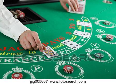 Stock Photo - Black Jack dealer at casino. Fotosearch