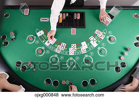 Stock Photo - Black Jack dealer at casino. Fotosearch