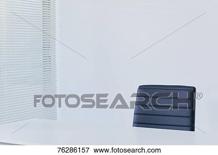 Stock Photo - Chair in white office. Fotosearch
