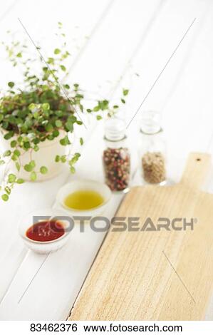 Chopping board and spices View Large Photo Image Stock Photograph - Chopping board and spices. Fotosearch