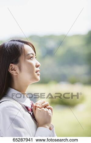 Cute Japanese high school student in a city park View Large Photo Image Stock Image - Cute Japanese high school student in a city park. Fotosearch