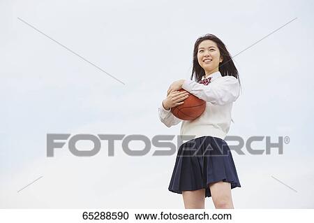 Cute Japanese high school student in a city park View Large Photo Image Stock Image - Cute Japanese high school student in a city park. Fotosearch
